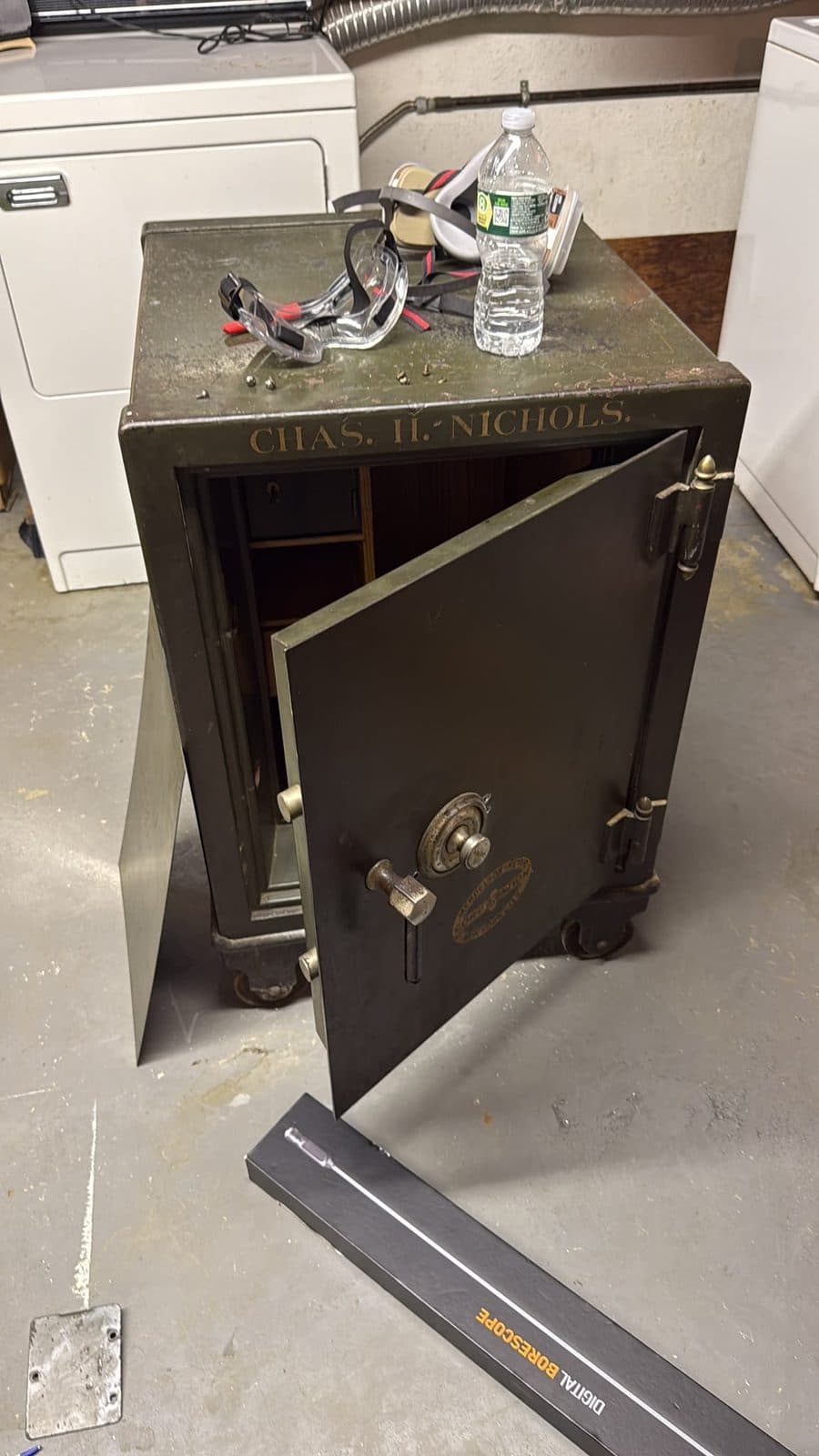 An antique Chas. H. Nichols safe with the door open