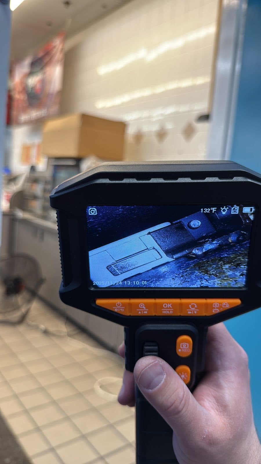 Amit reading a borescope camera to see inside a safe lock